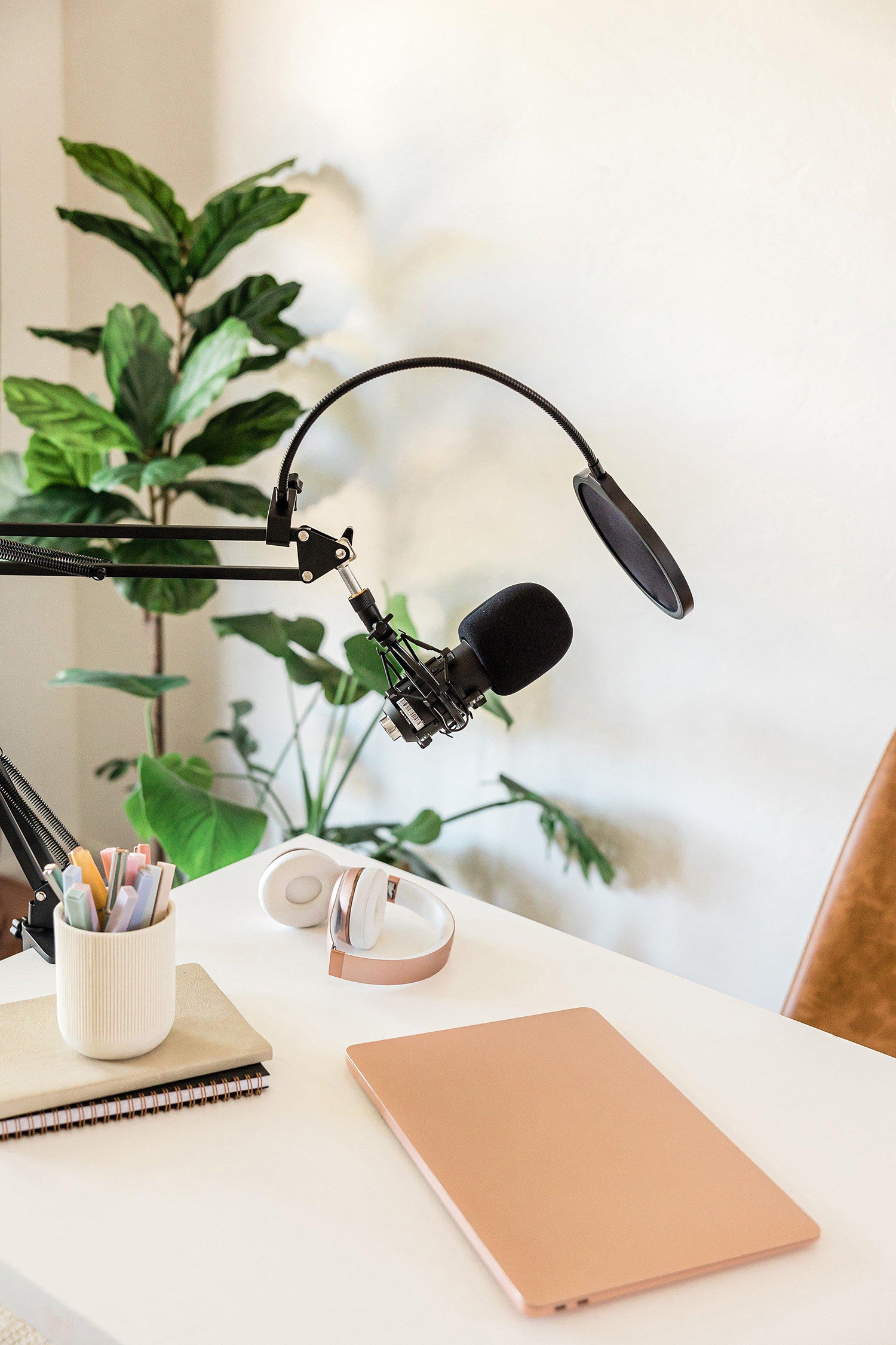 podcast-launch-roadmap desk with podcast mic and notebooks
