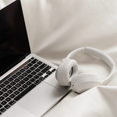laptop at remote office with headphones