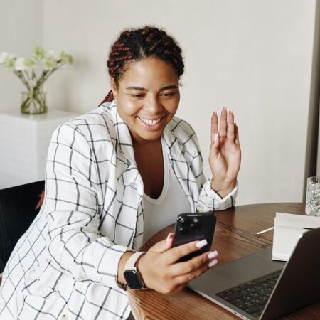 entrepreneur on phone while working on podcast strategy