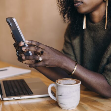 Podcaster checking podcast distribution across multiple platforms to future-proof against algorithm changes